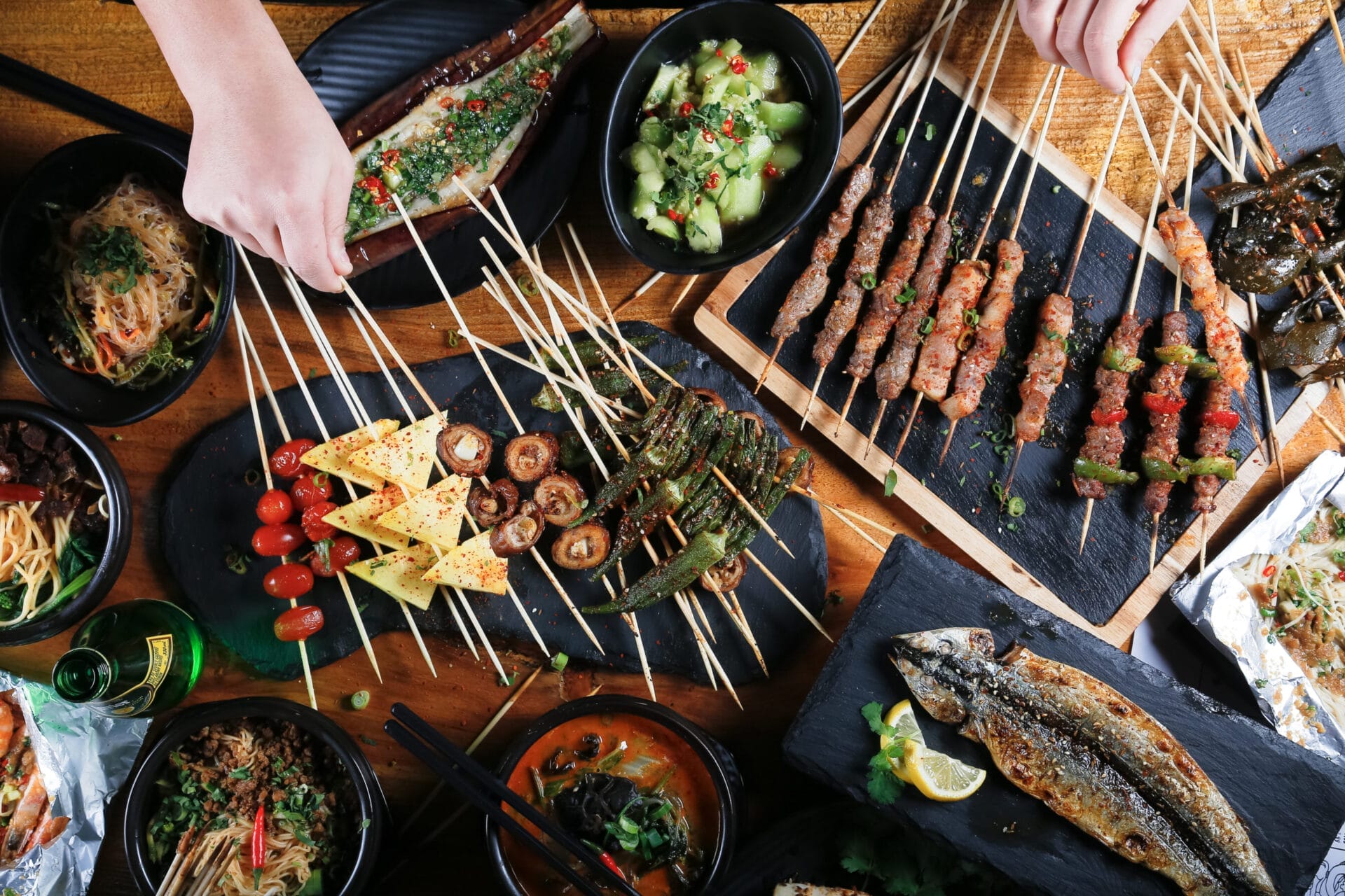 Meat, seafood, and vegetable skewers.