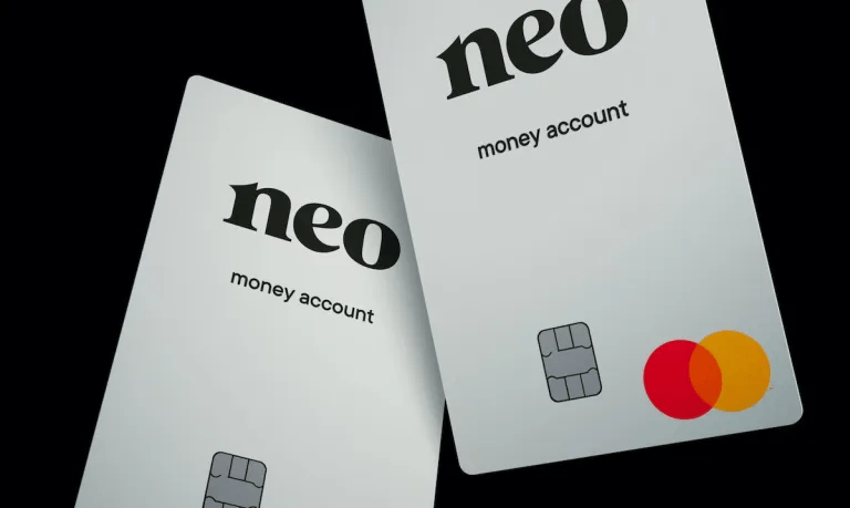 Two Neo Financial money account cards with a sleek white design, black text, and a Mastercard logo on a dark background.