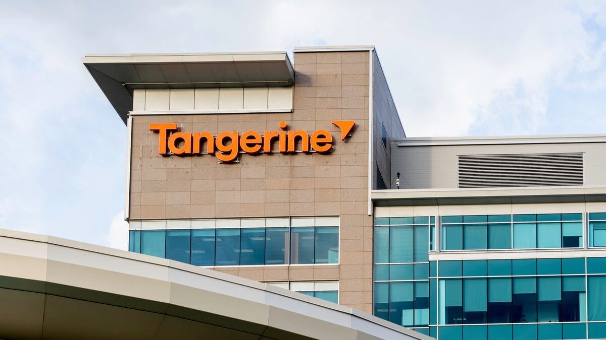 A modern office building with the "Tangerine" bank logo in bold orange letters on the exterior, featuring large windows and a sleek architectural design.