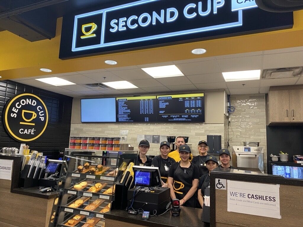 Staff at a newly opened Second Cup Cafe, largest Canadian coffee specialty retailer.