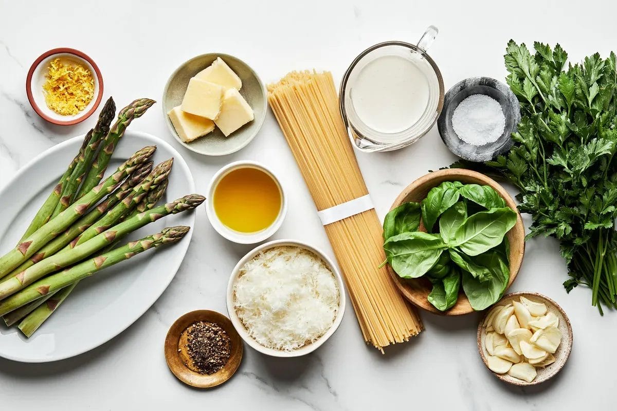 spaghetti, olive oil, asparagus, garlic, pepper, lemon zest, romano, heavy cream, salt, butter, parsley & basil
