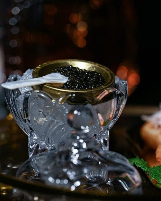 A can of caviar with a spoon