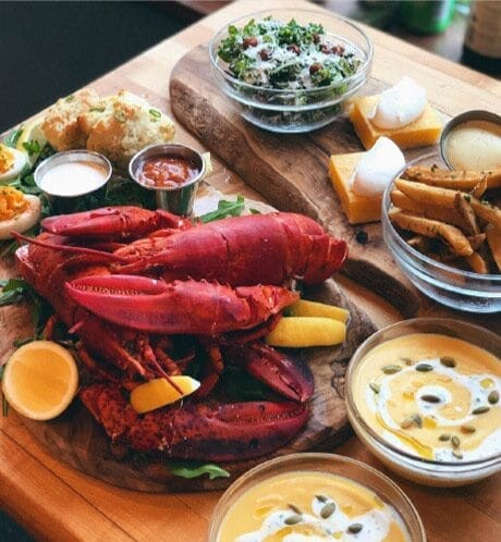 lobster dinner with side salad, soup and bread etc