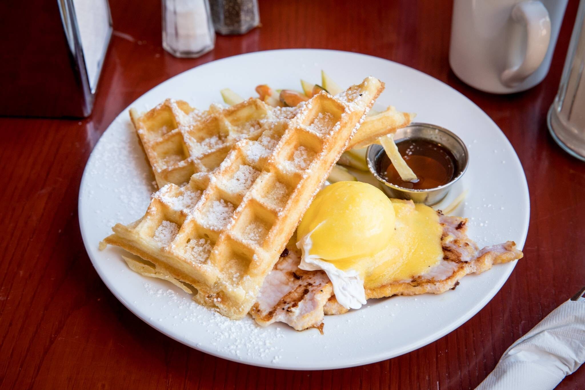 delicately plated waffle egg benny
