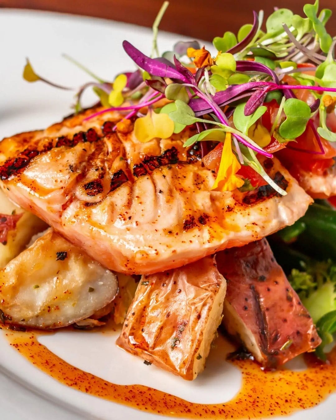 Grilled salmon with honey glaze served with roasted potatoes and fresh greens for a fancy Father’s Day.