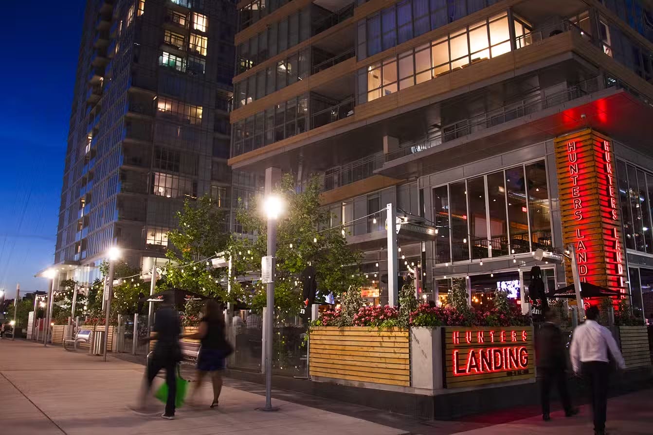 Hunters Landing patio restaurant in Toronto with outdoor dining and city views at night