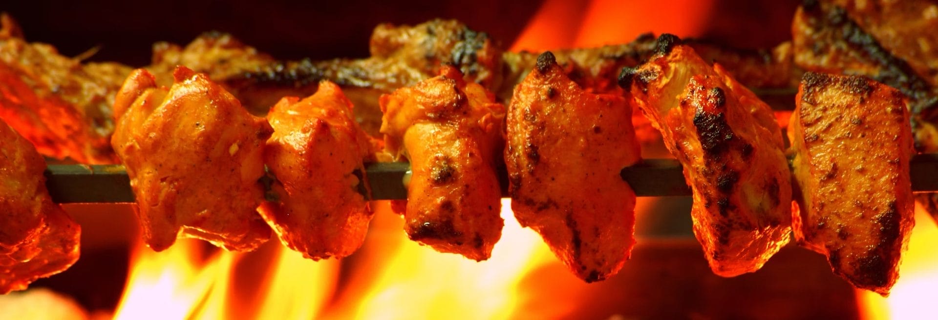grilled chicken skewers and wraps from Ji - Modern South Asian Grill.