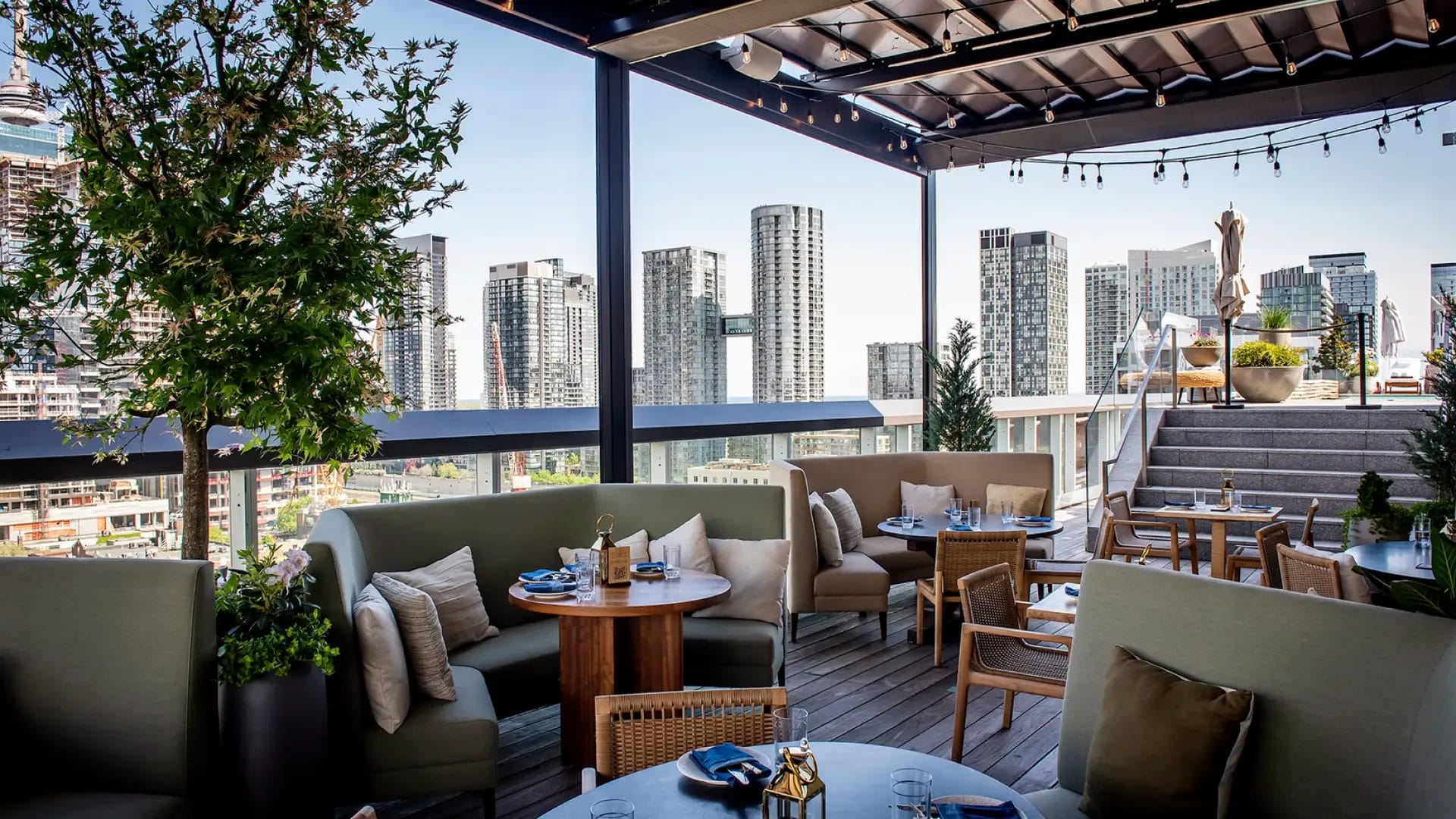 Harriet’s Rooftop patio in Toronto with skyline views, outdoor seating, and rooftop dining above King West