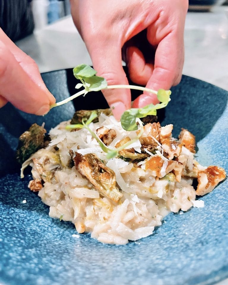 Risotto plating during a hands-on cooking at Dish Cooking Studio in Toronto