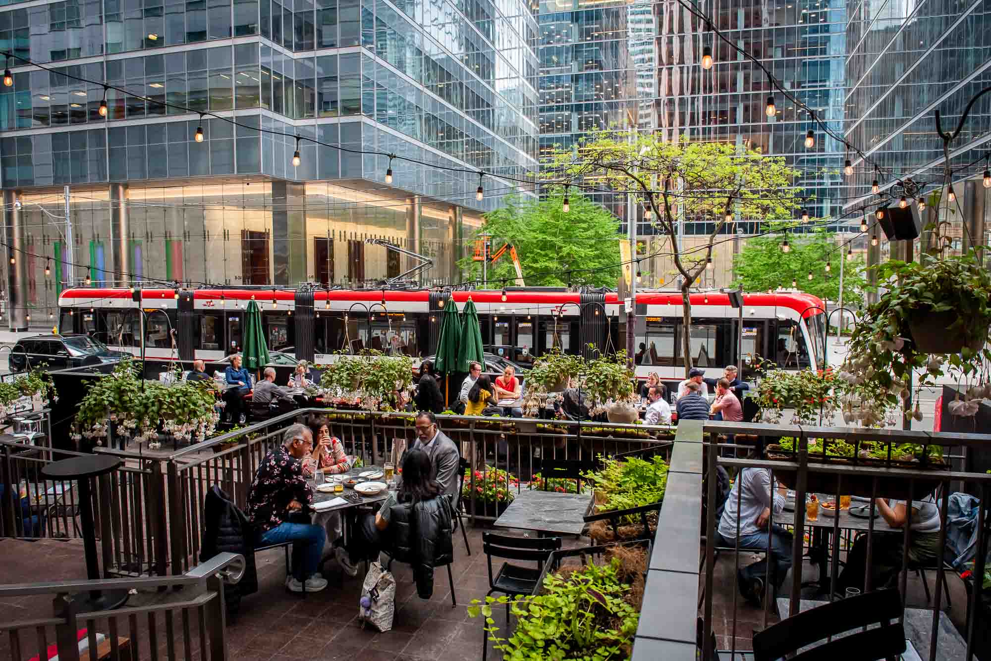 Outdoor patio seating at The Rabbit Hole restaurant in downtown Toronto during summer
