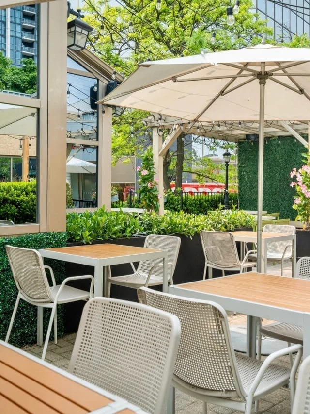 Tucked inside a converted historic building, this patio offers a quieter escape from the usual City Centre rush. Surrounded by greenery and built for slower evenings, it’s the kind of spot that makes long summer dinners feel easy and unhurried.