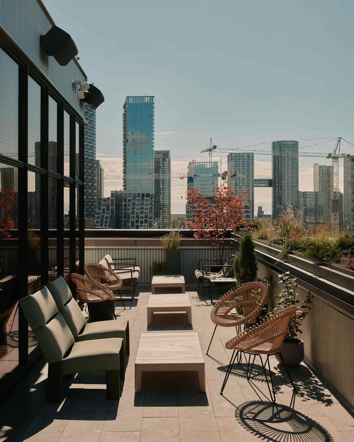 Evangeline sits atop the Ace Hotel Toronto, offering cocktails and skyline views in a popular Fashion District rooftop setting.