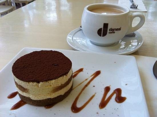 Tiramisu cake with a fresh served coffee perfect for the afternoon craving.