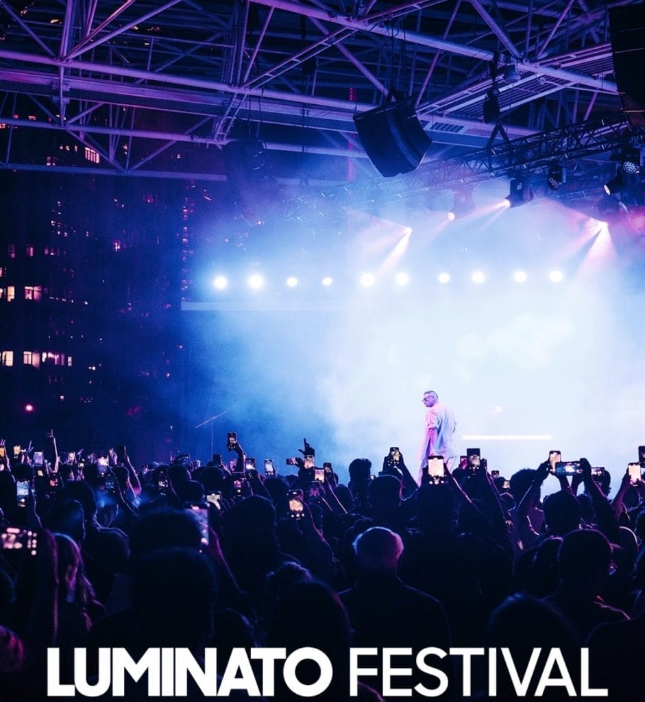 Toronto Summer Festivals You Can’t Miss This June with a large crowd enjoying live music at an outdoor event.