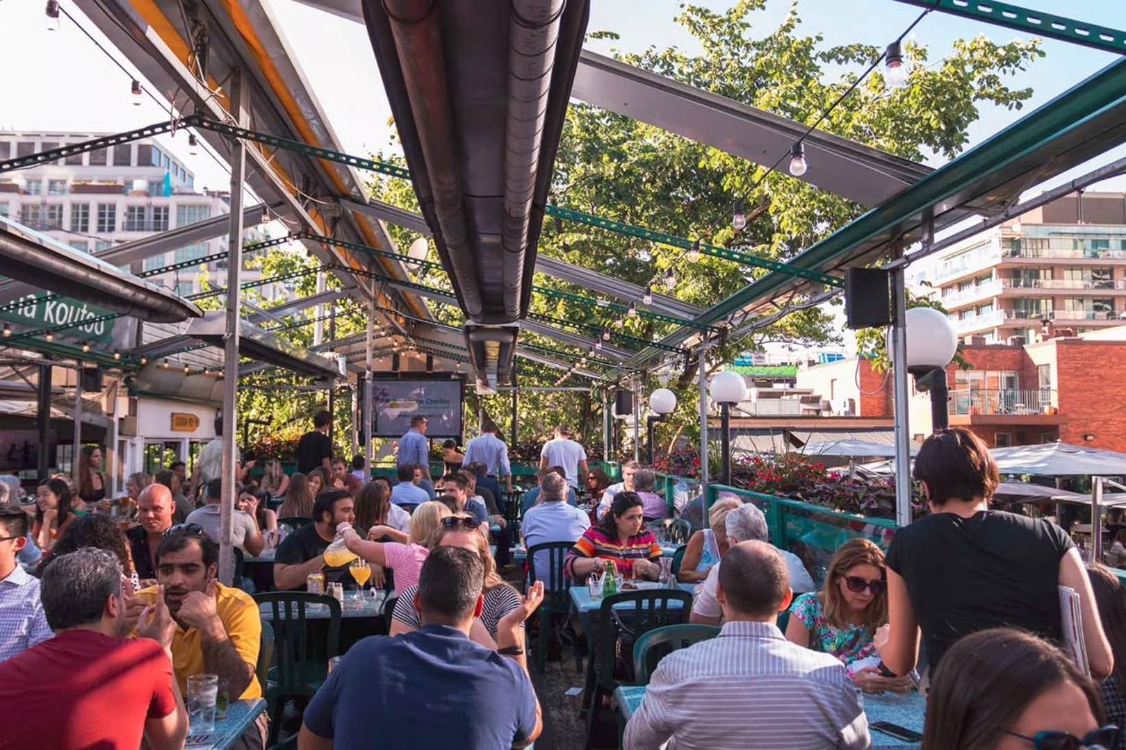Rooftop patio seating at Hemingway’s restaurant in Toronto during summer