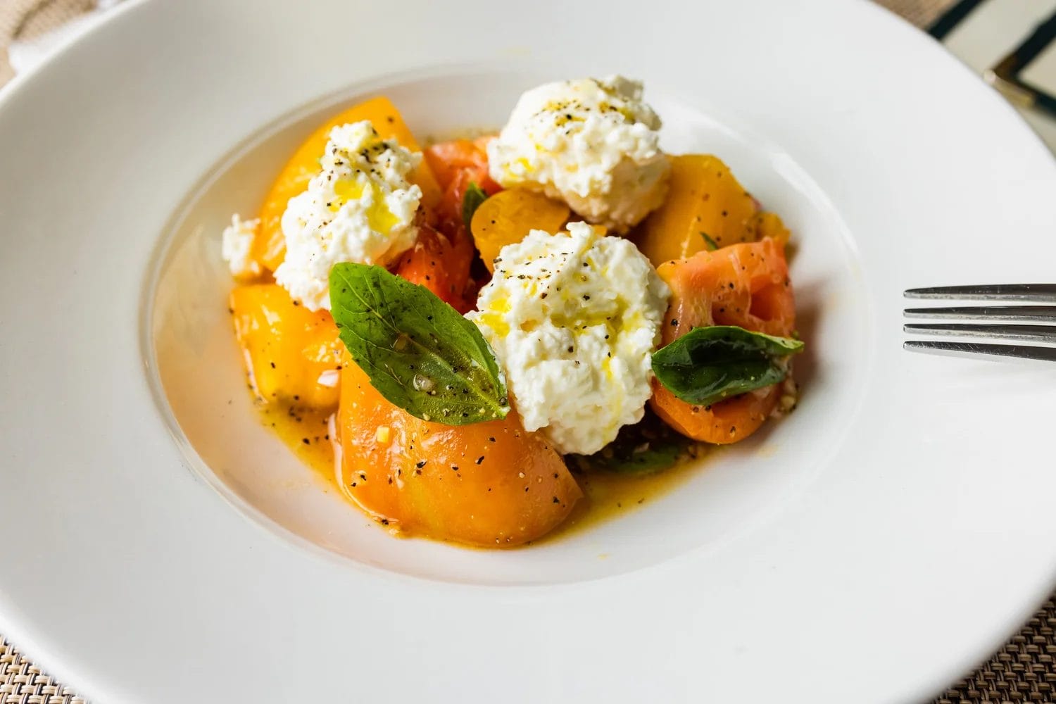 Fresh burrata and seasonal fruit salad served at The Senator, a popular Father's Day Brunch Toronto destination.